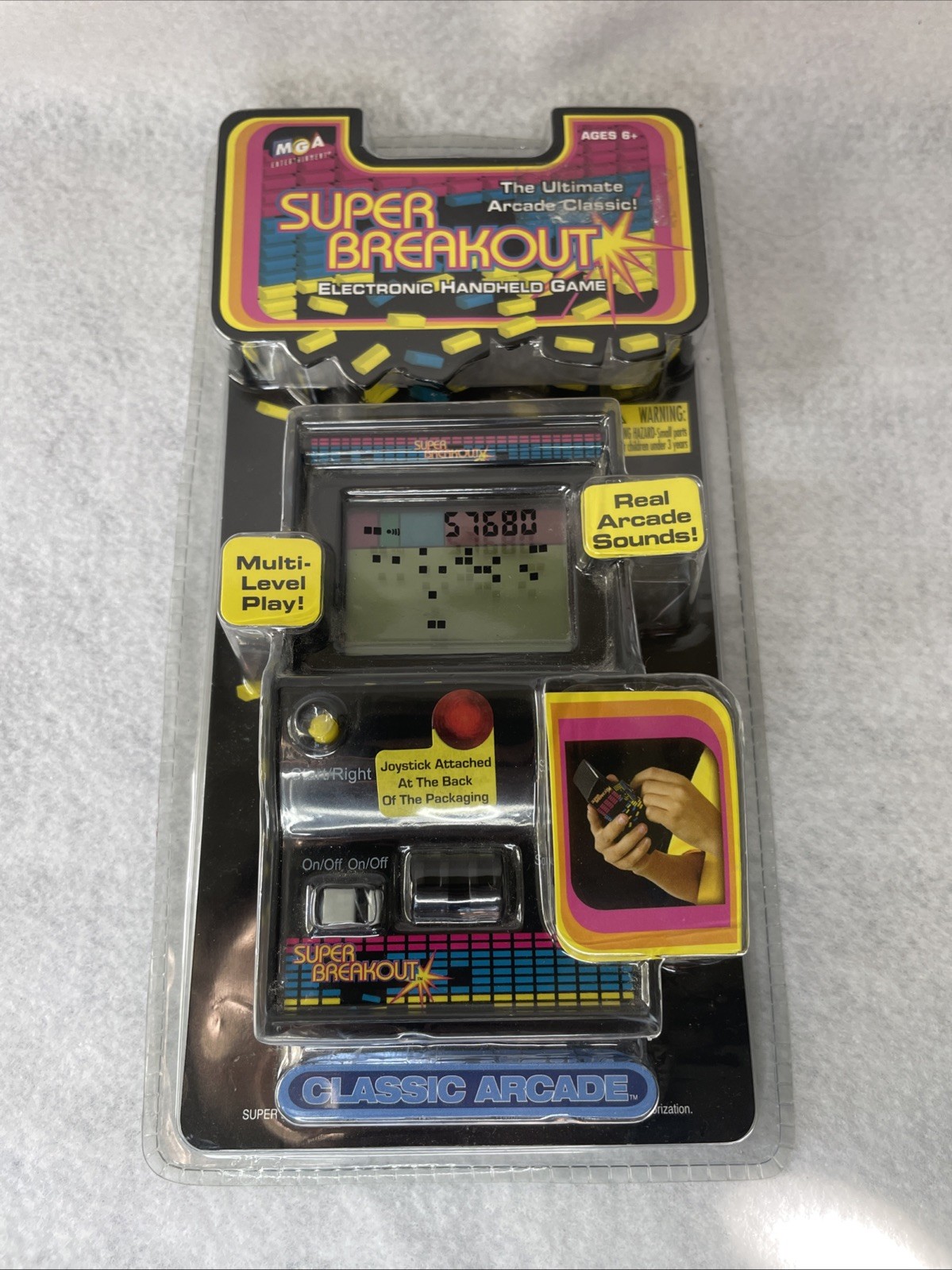 Super Breakout Electronic Handheld Game by MGA Entertainment