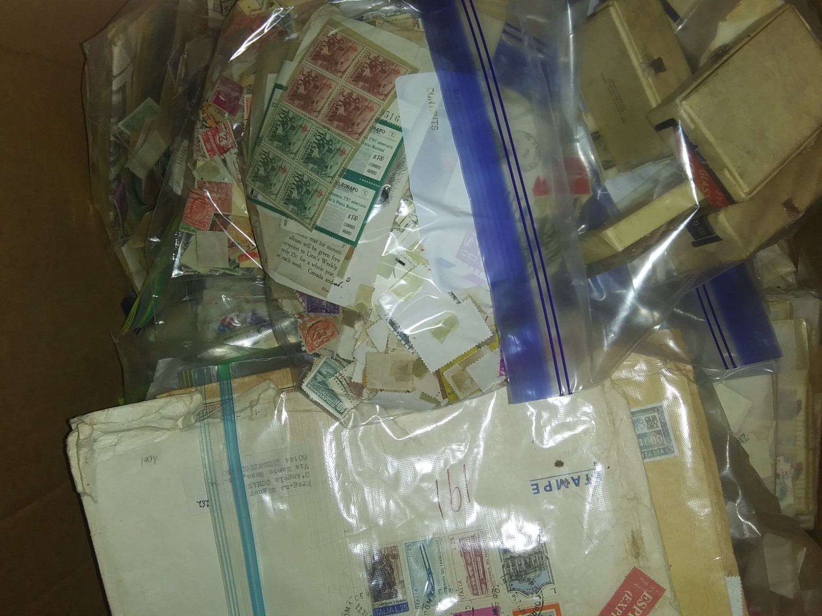 Box of Postal Stamps  with Old Stamp Book