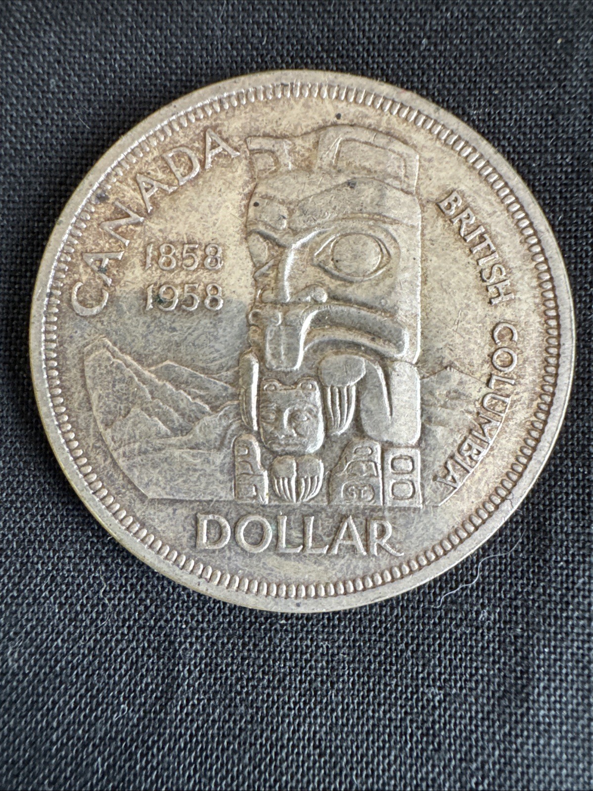 1958 canadian totem pole silver dollar