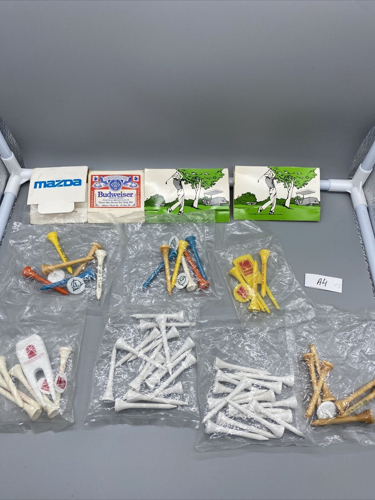 New/Never Used Vintage Wooden Golf Tees Multi Colored Kodak,Budweiser And Other