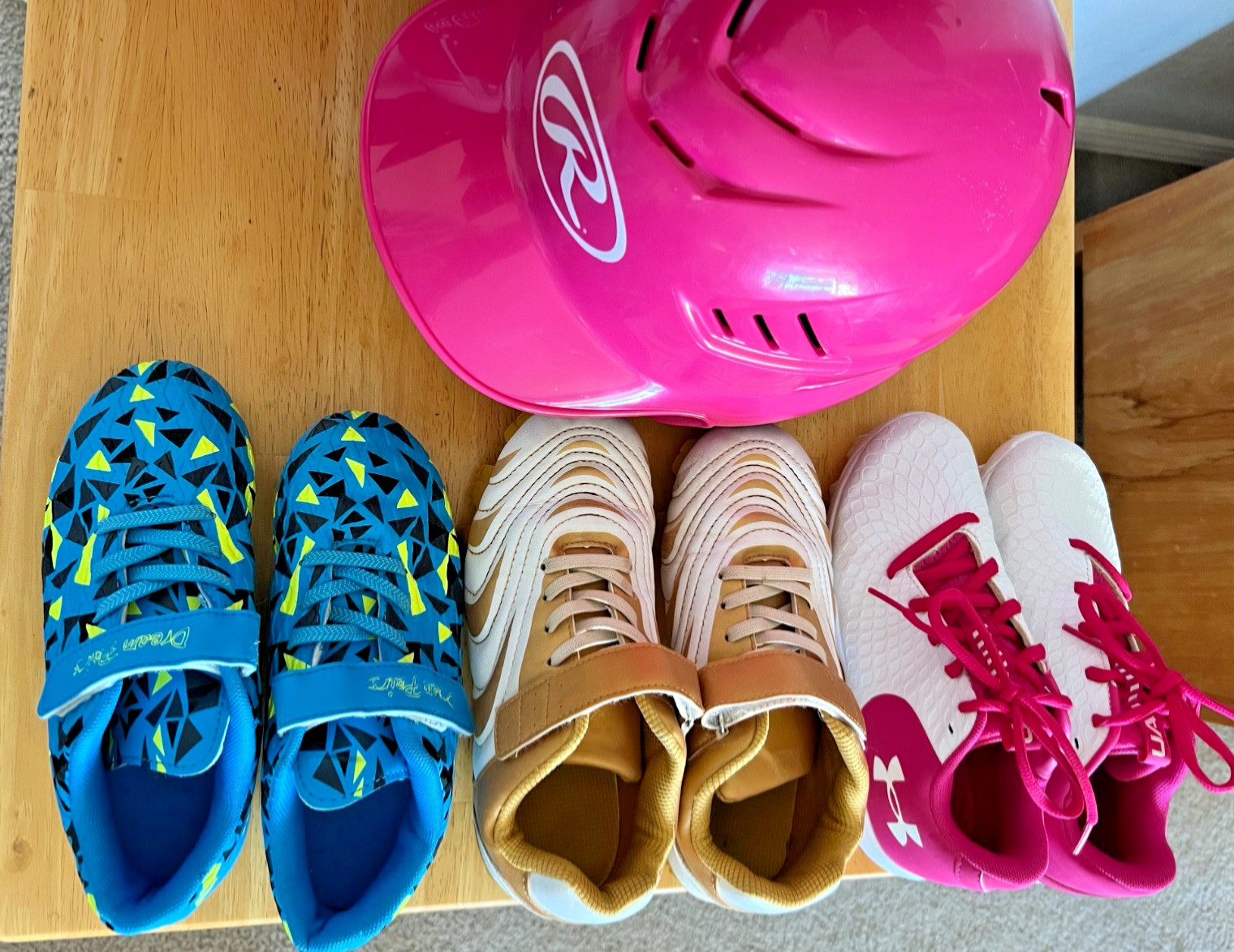 lot of 3 pairs of girls cleats size size 2 & 2.5 and rawlings softball helmet