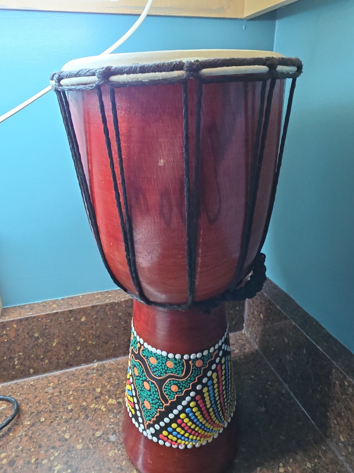 Hand Carved Djembe drum features a hand-painted tribal design