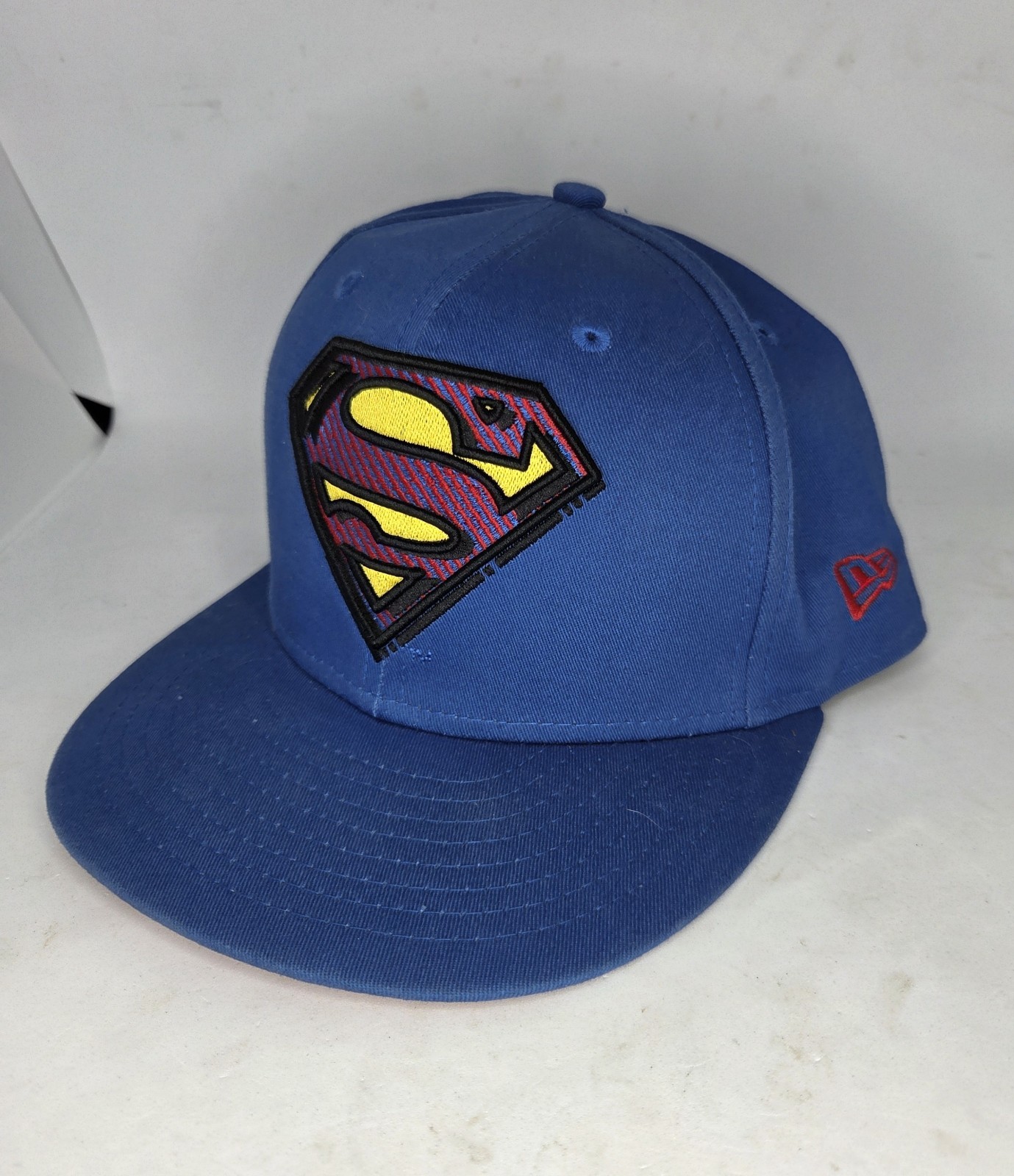DC Comics Superman Side Panel Logo New Era Snap Back Flat Bill Embroidered