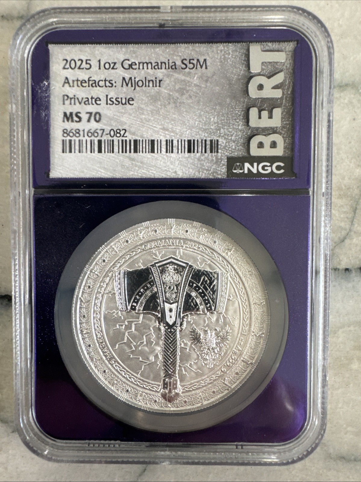 2025 1oz Germania Artefacts: Mjolnir NGC MS70 Trader Bea purple core