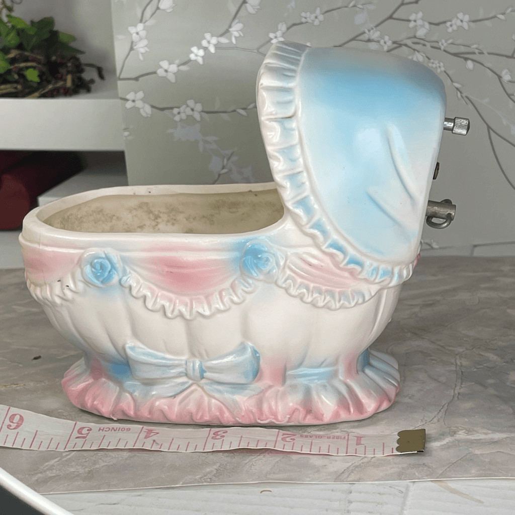 Inarco E- 3502 musical baby bassinet planter.