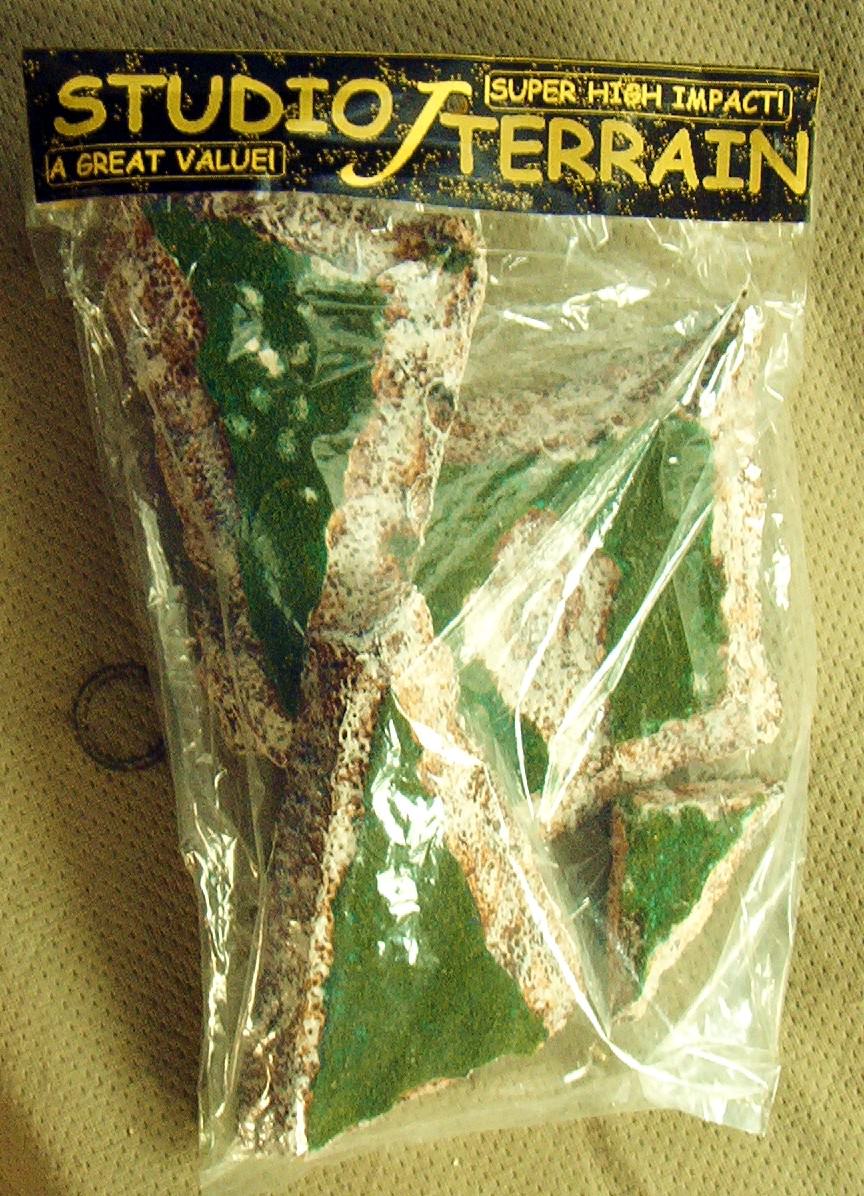 Studio J brand miniature wargaming terrain. (green top set)