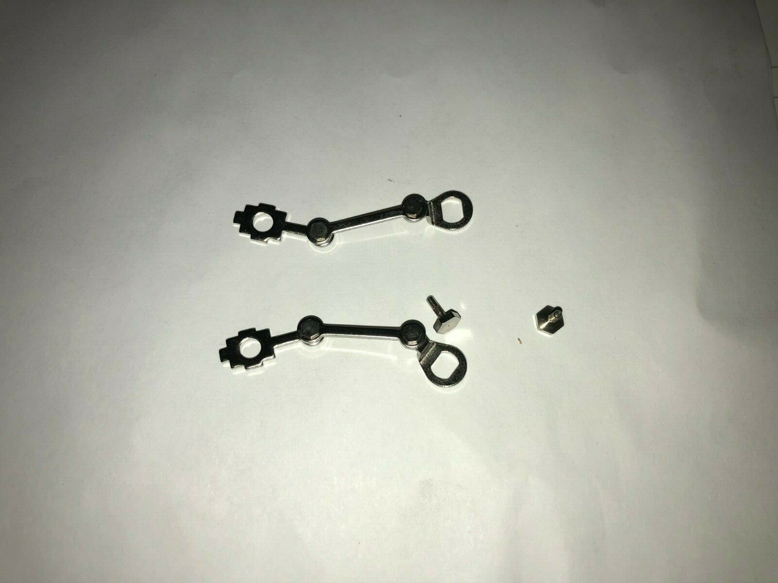 LIONEL PARTS , 682 , PAIR OF VALVE GEARS & BODY MOUNTING RIVETS