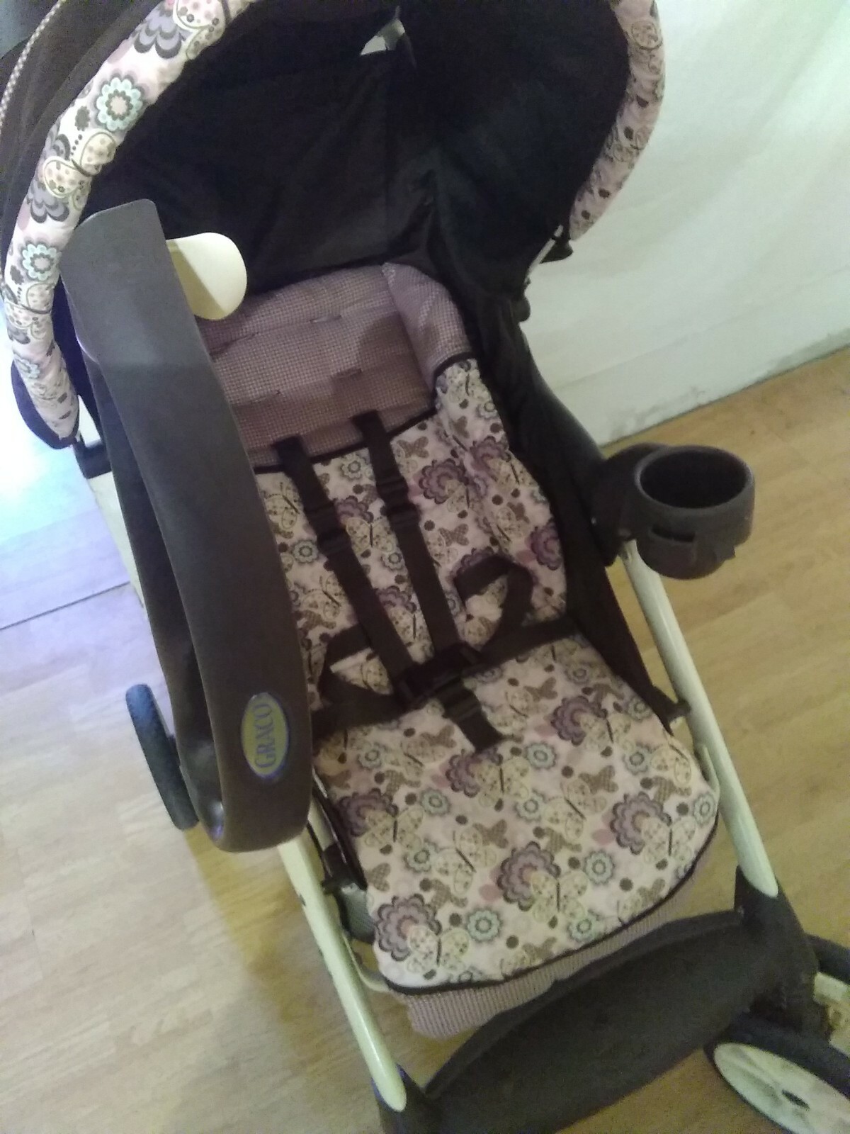 Graco Stroller walk behind with built in cupholders 
