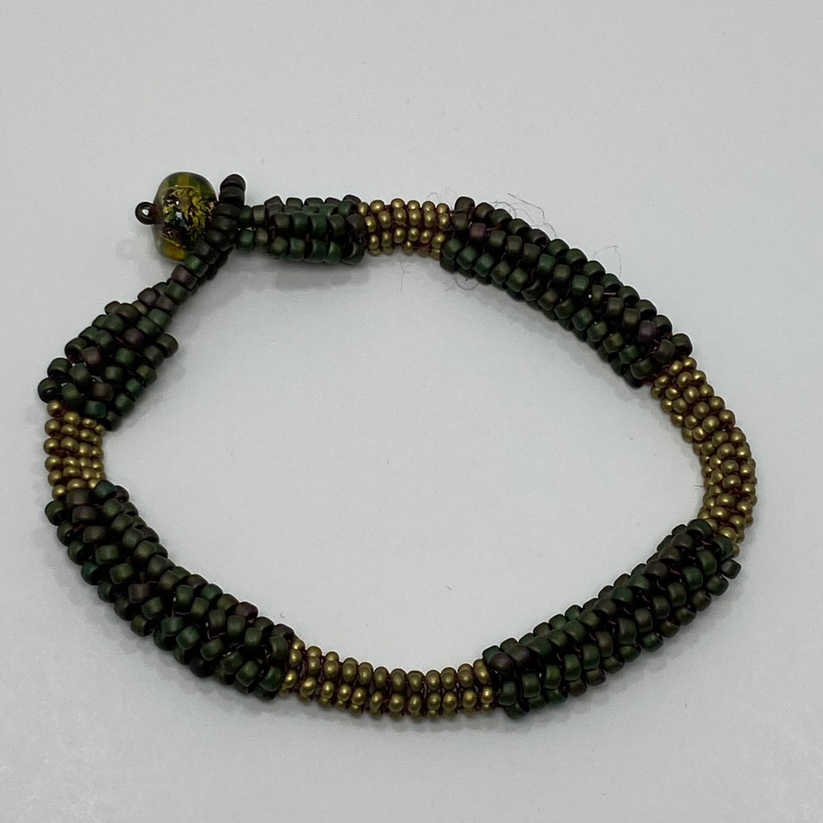 Multi Colored Matte Seed Bead Multi Strand Tube Bracelet Green Gold