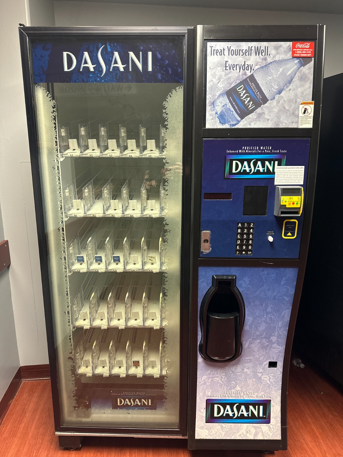 rare Dixie Narco refrigerated vending machine with Dasani Graphics