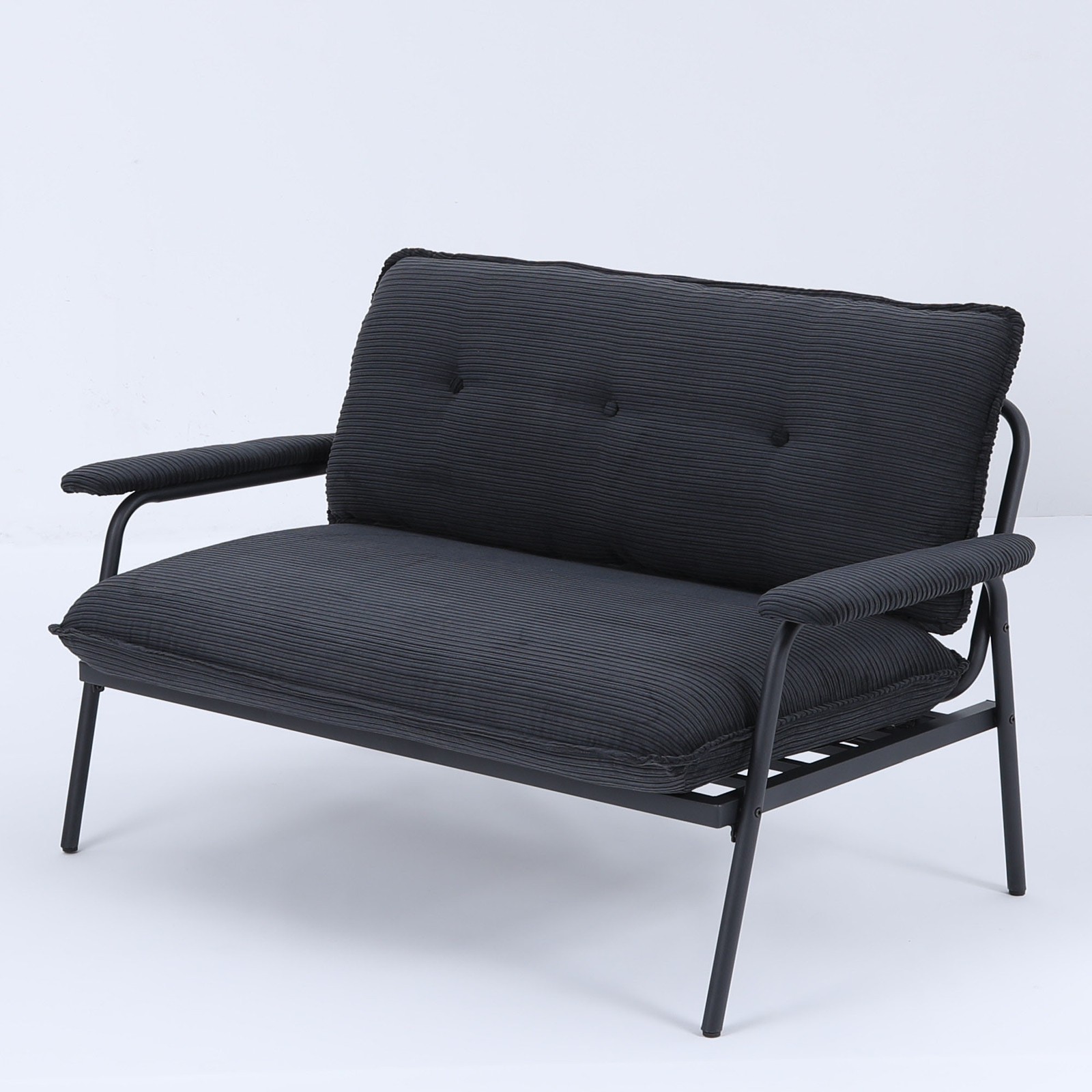 The 53-inch black sofa offers a spacious layout in the small apartment, easily