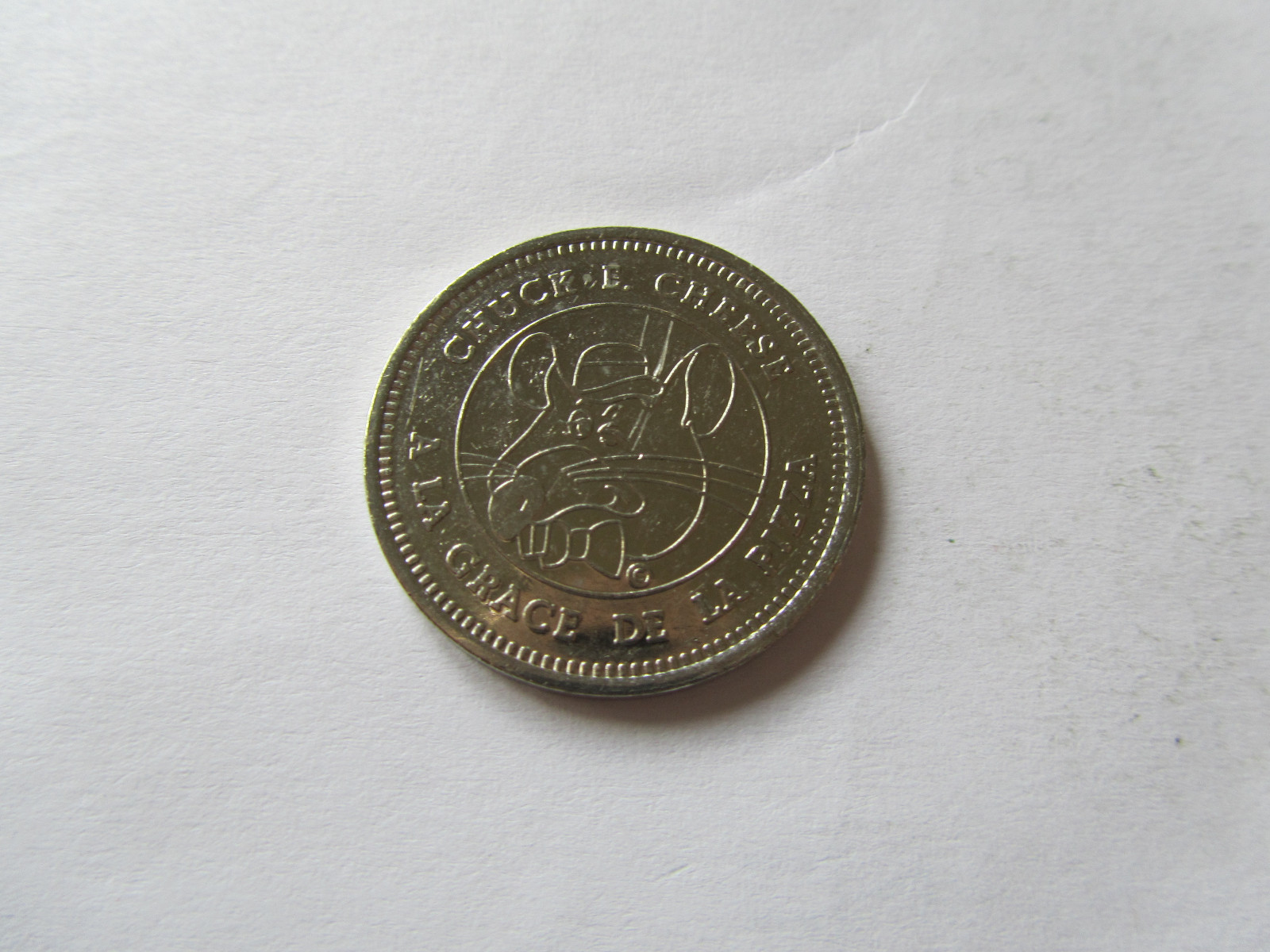 RARE FRENCH CANADIAN NICKEL Chuck E Cheese A LA GRACE DE LA PIZZA TOKEN COIN