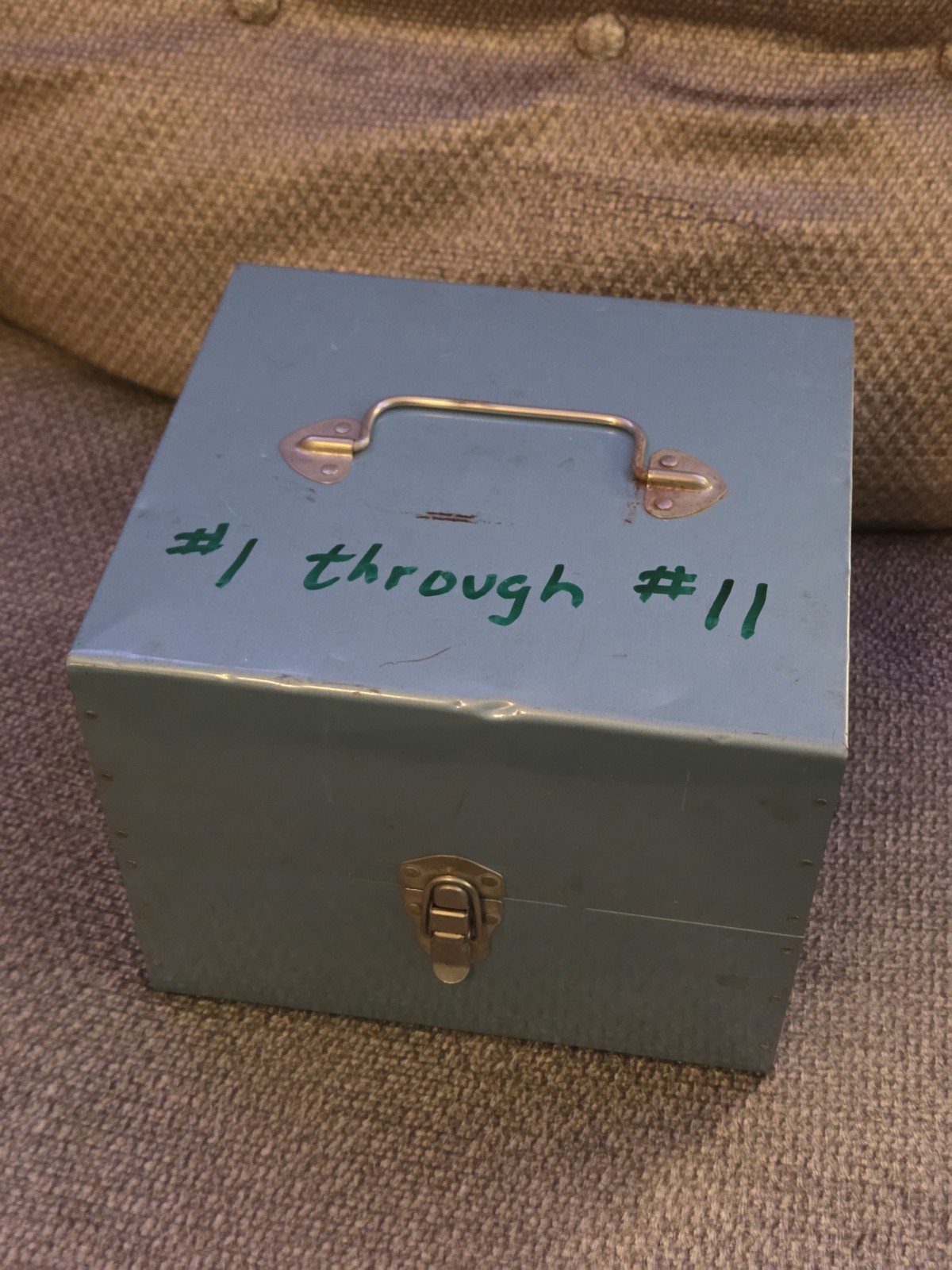 Eleven (11) 7" Diameter Movie Reels with Metal Cans and Carrying Case