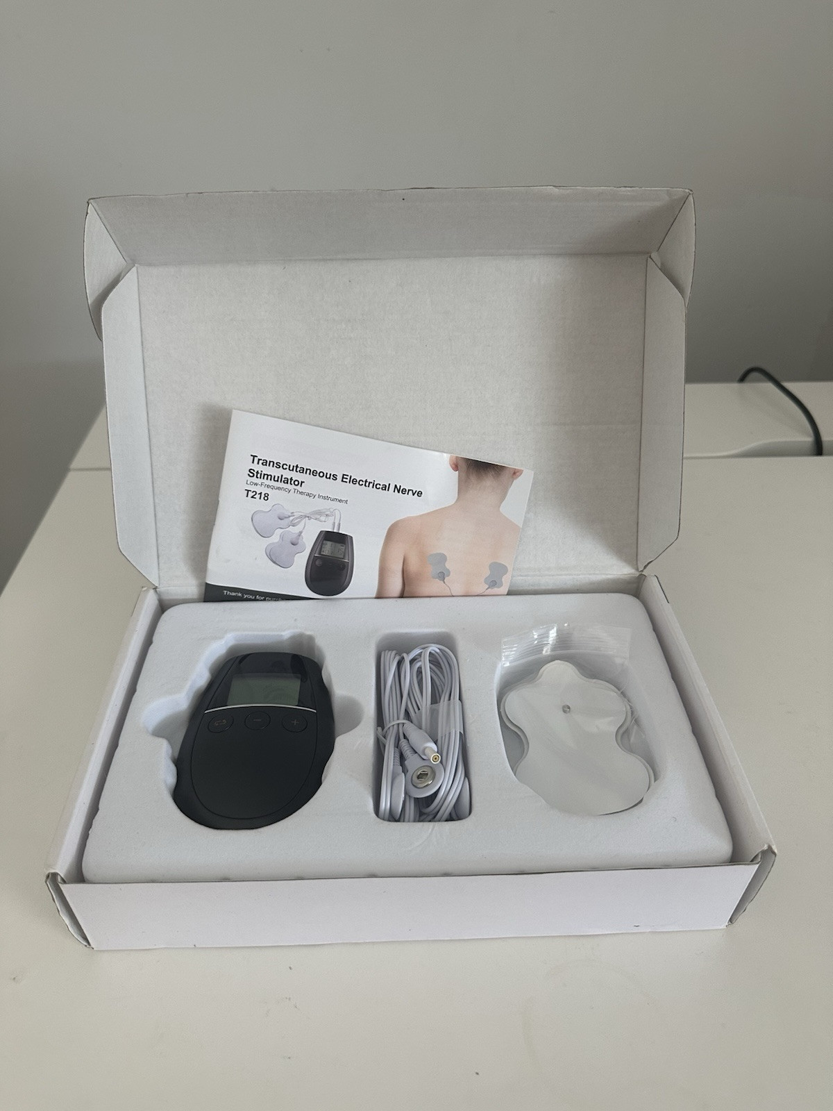 Transcutaneous Electrical Nerve Stimulator and Pads TKR