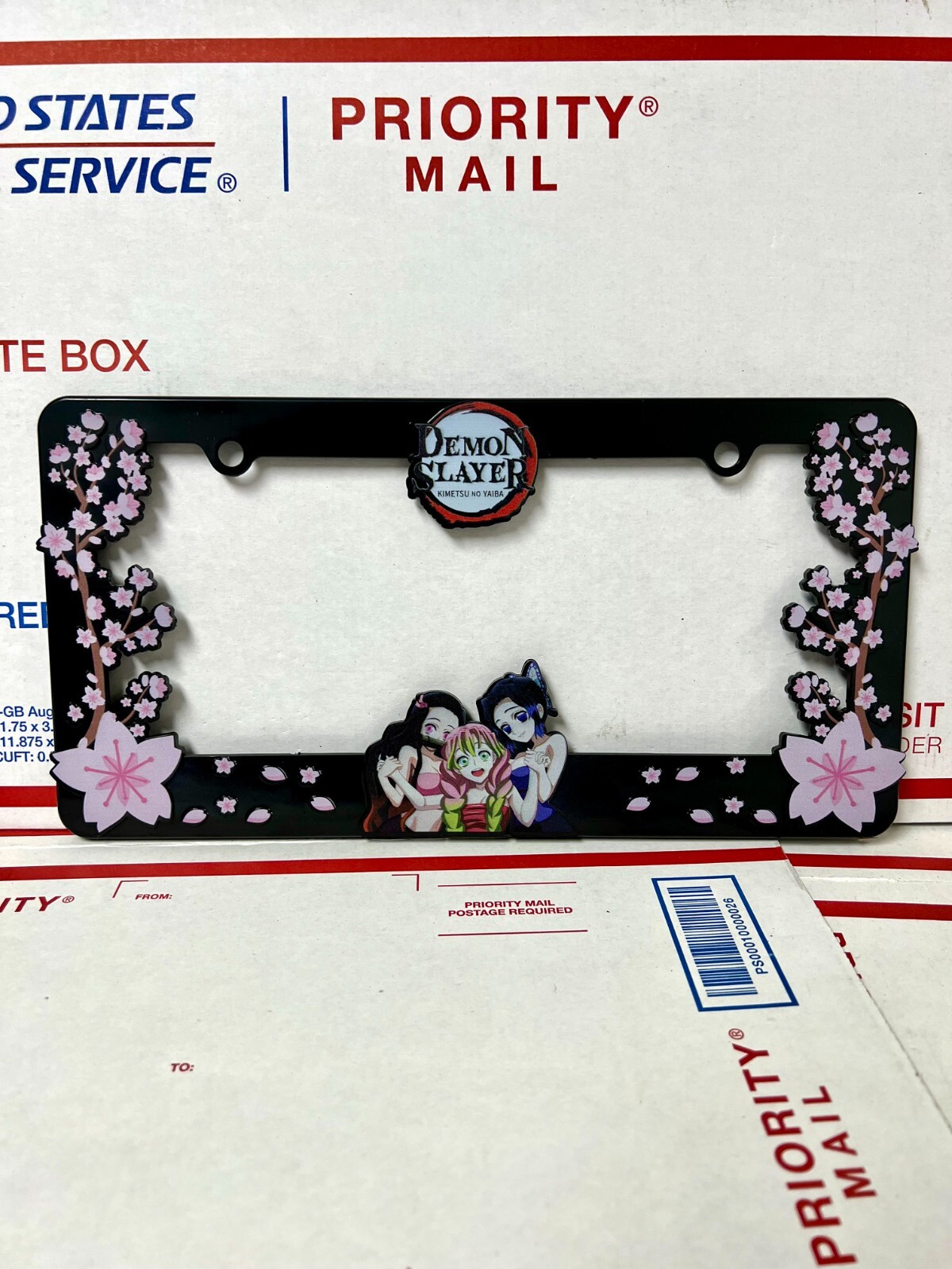 Demon Slayer License Plate Frame featuring Nezuko, Shinobu, and Matsuri