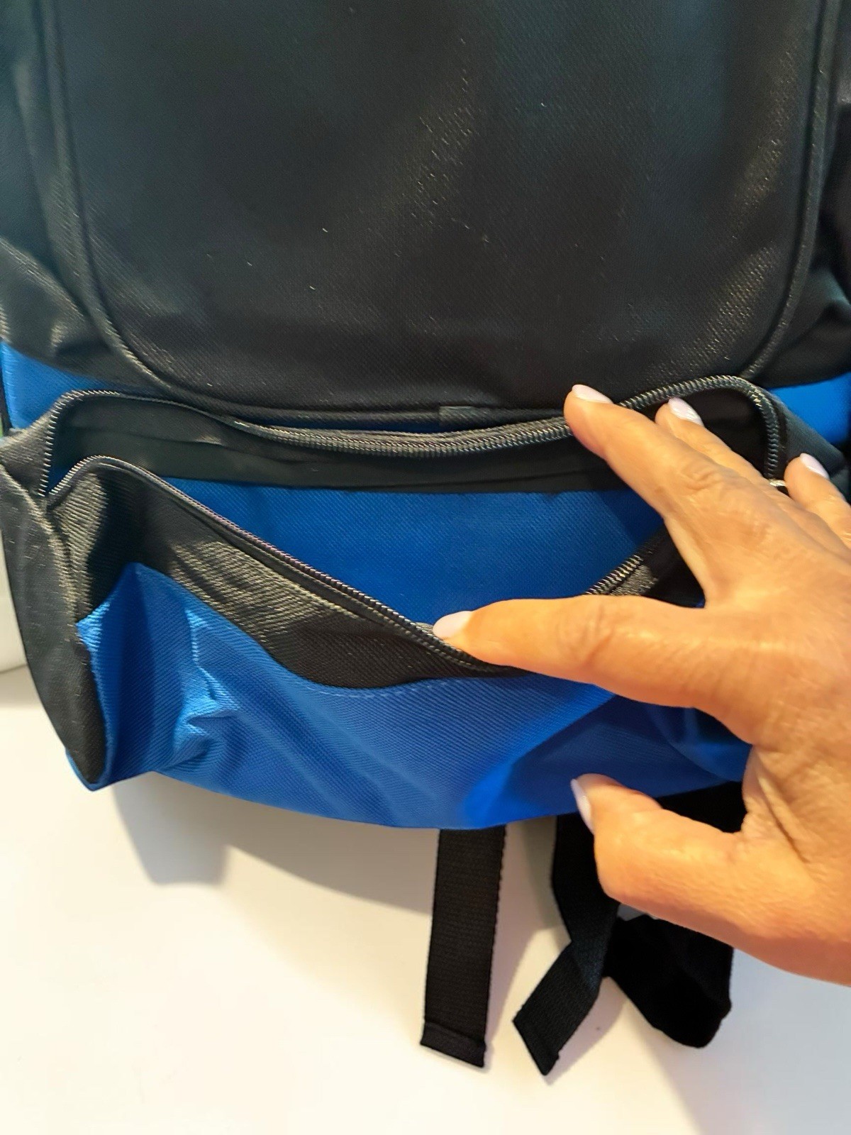 Black And Blue Backpack With Many Pockets.