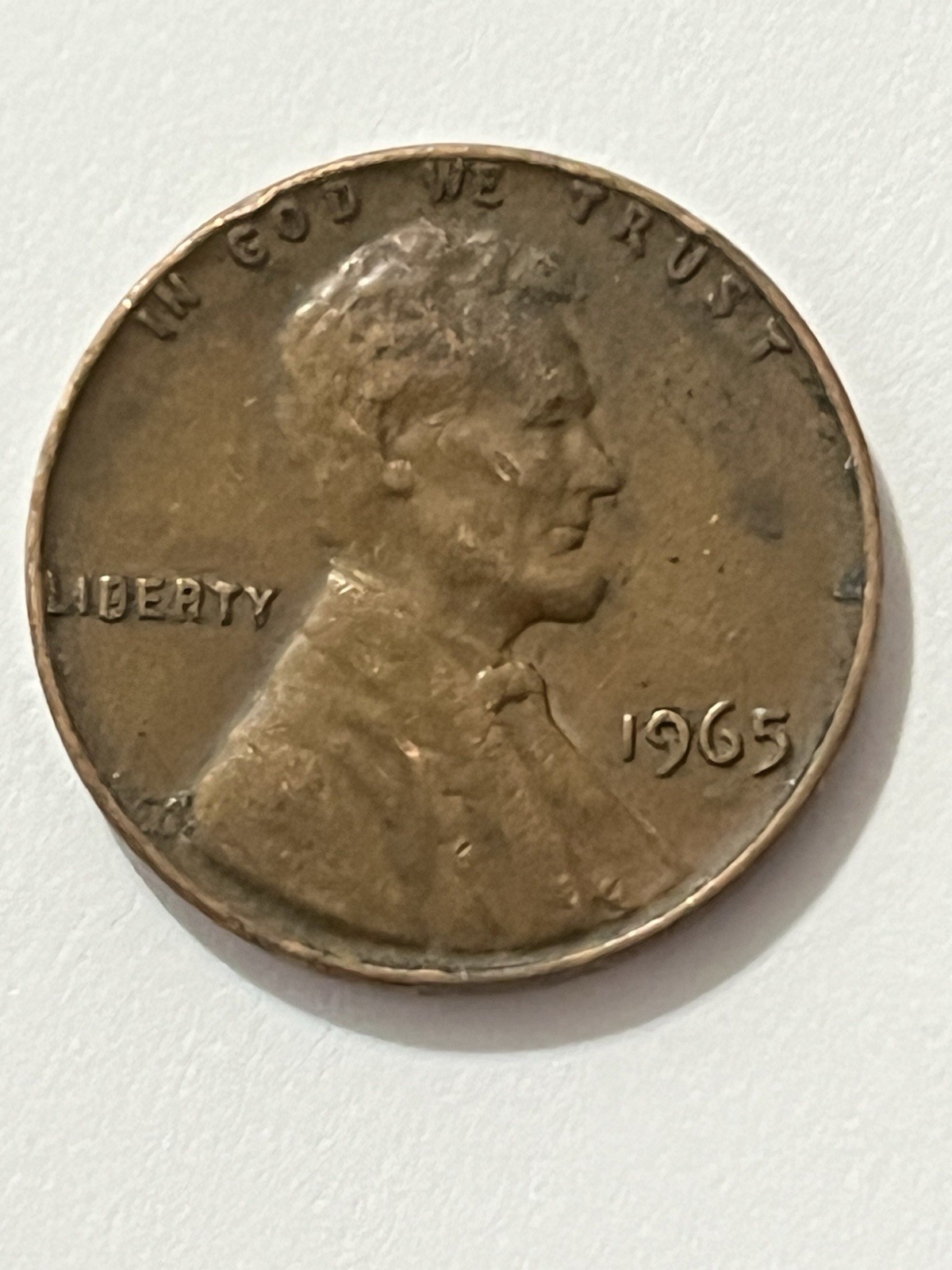 1965 “In God We Trust” and “L” in Liberty is on the rim