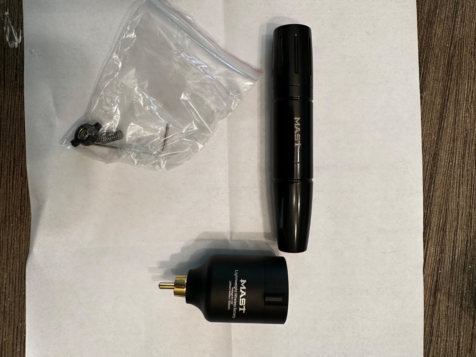 dragonhawk rotary mast magi pen tattoo machine and wireless battery. 
