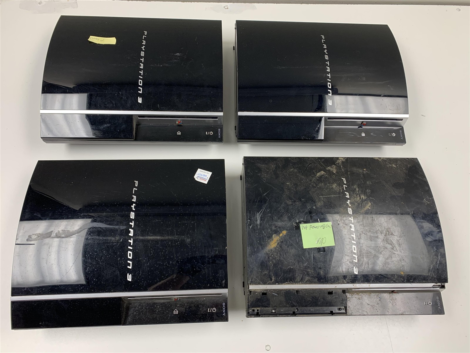 Lot of 4 Damaged Non-BC PS3 Fat Consoles FOR PARTS OR REPAIR AS-IS Bulk