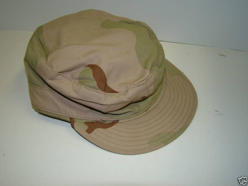 Tan Camouflage Hat with Ear Flaps.