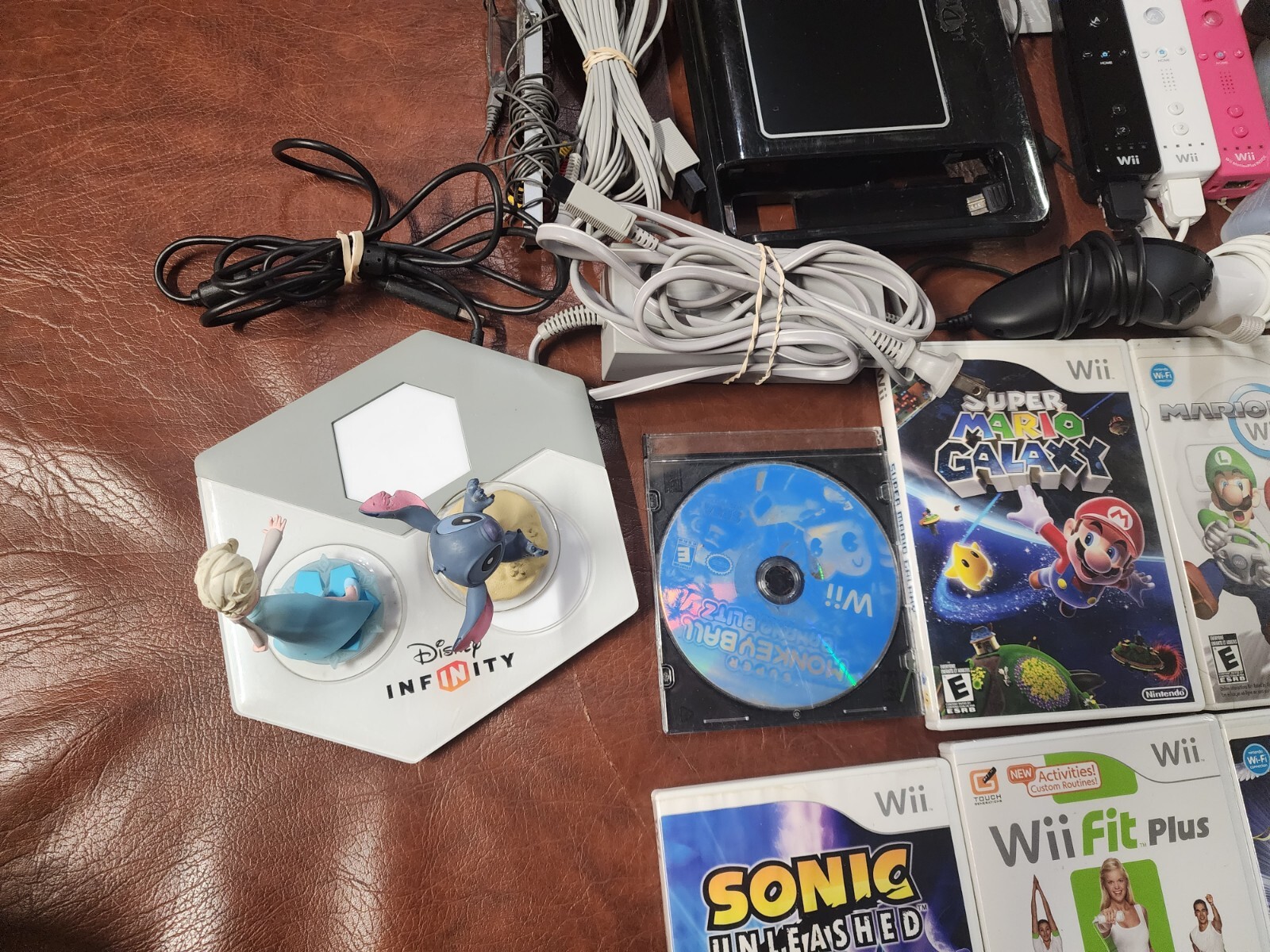 Wii Console plus, 9 games, 2 remotes, 1 nunchuck, System Plus Hookups & More