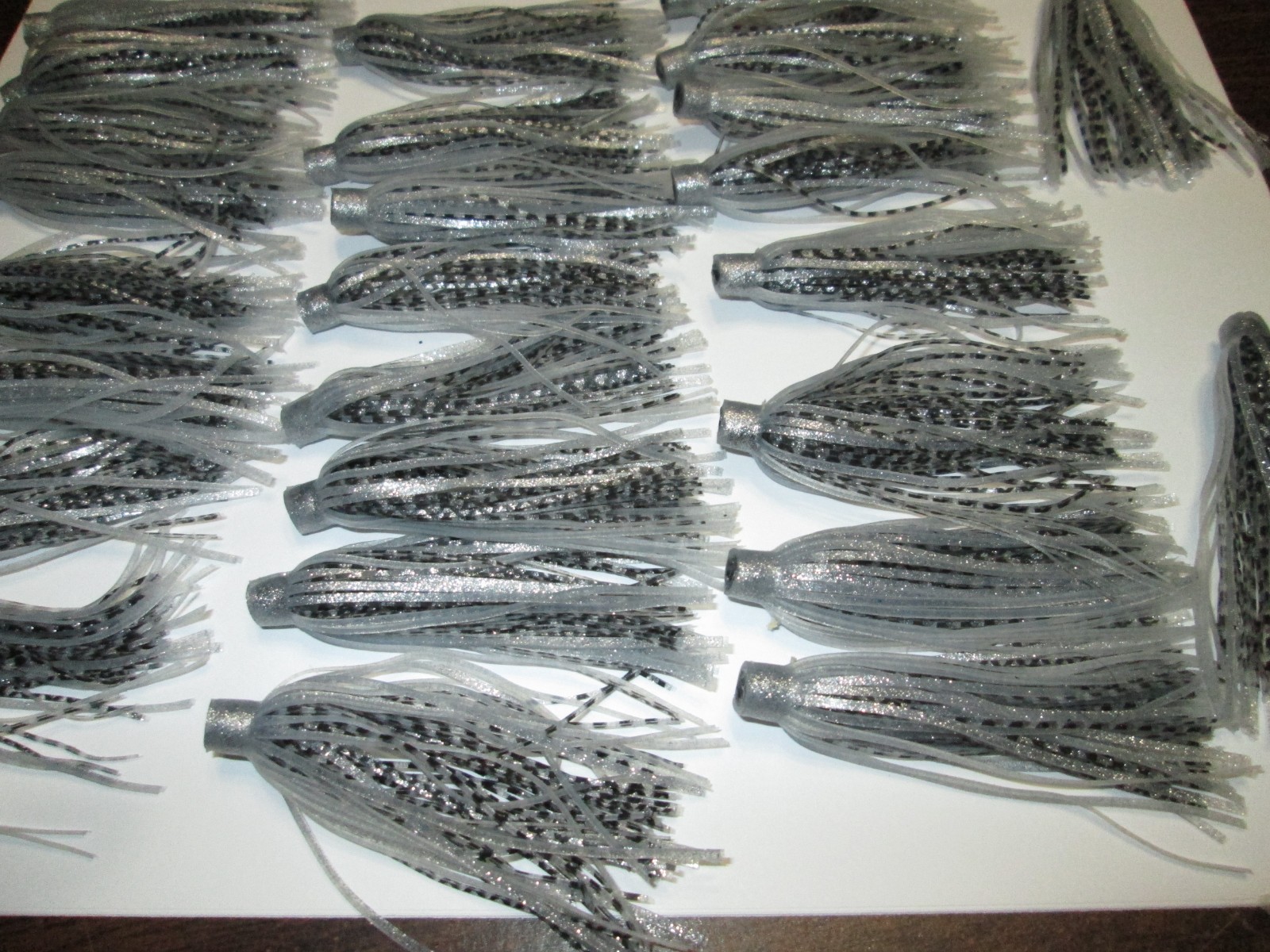 25 - QUICK CHANGE SILICONE RUBBER SKIRTS - 3" LONG - SILVER AND BLACK,,