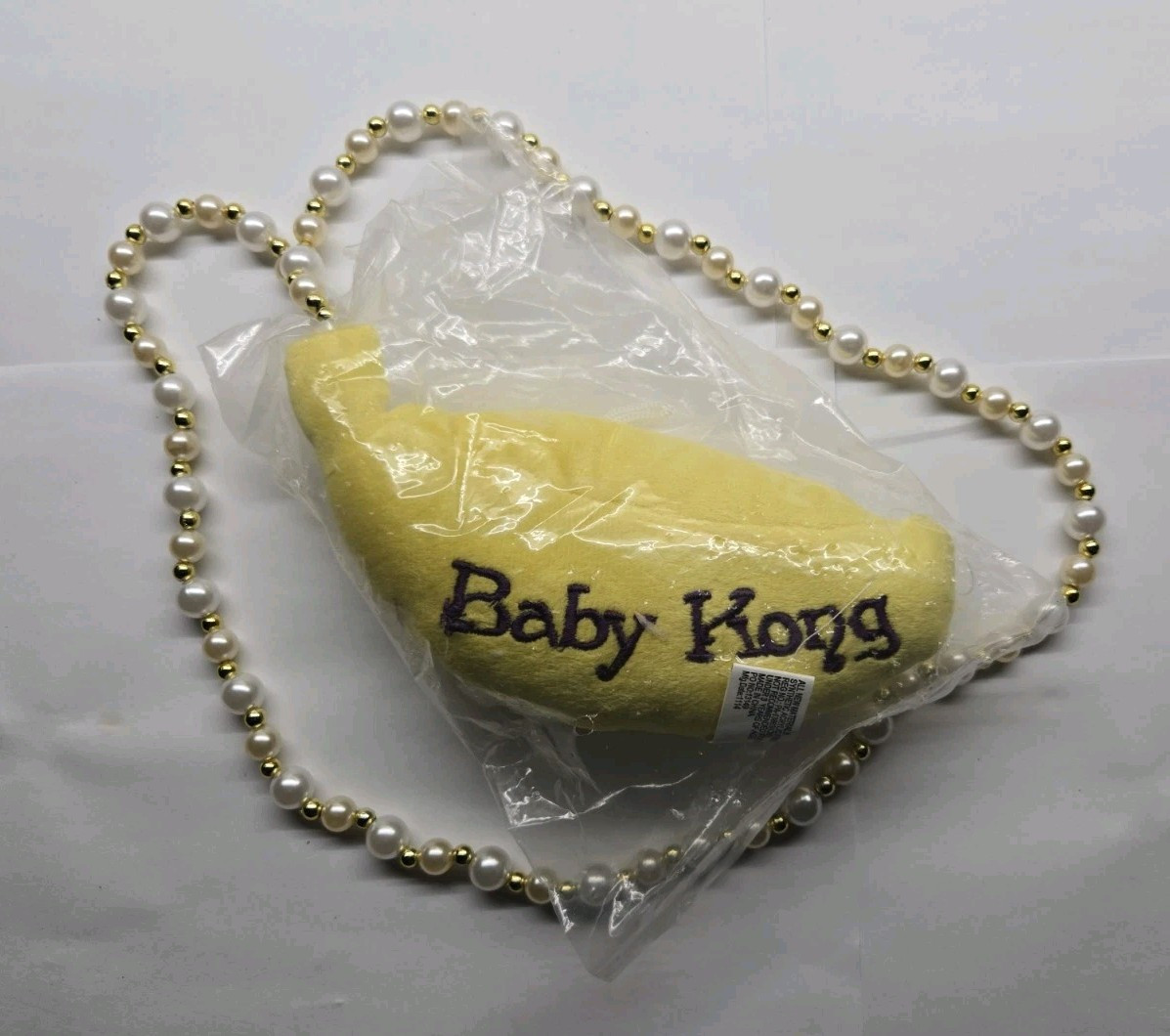 Baby Kong Plush Banana Mardi Gras Necklace