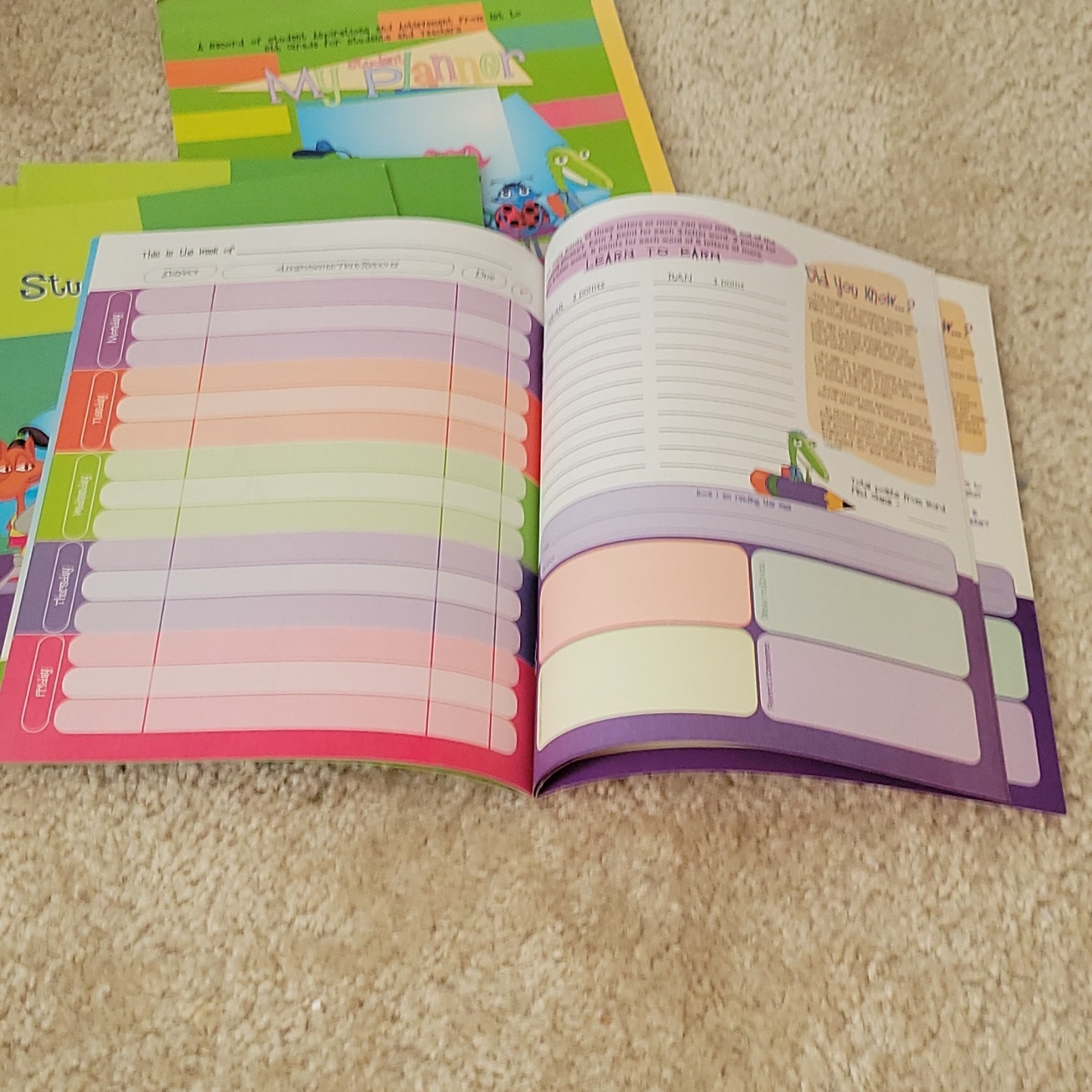Five AES PHEAA Quarterly Assignment books, One My Student Planner Elementary