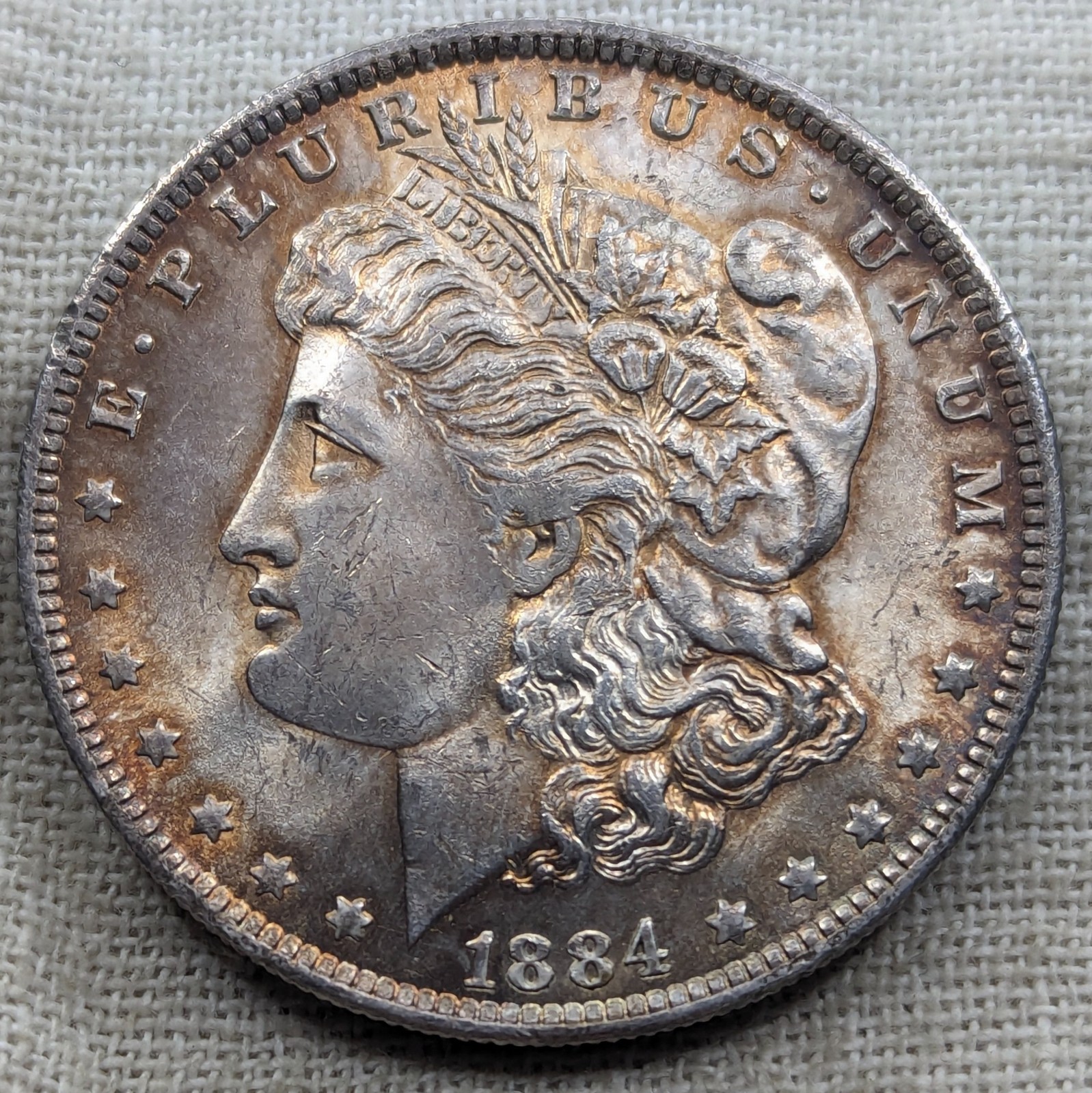 1884 O Morgan Dollar AU+ : Toned, Lustrous , Almost Uncirculated - .9 Fine
