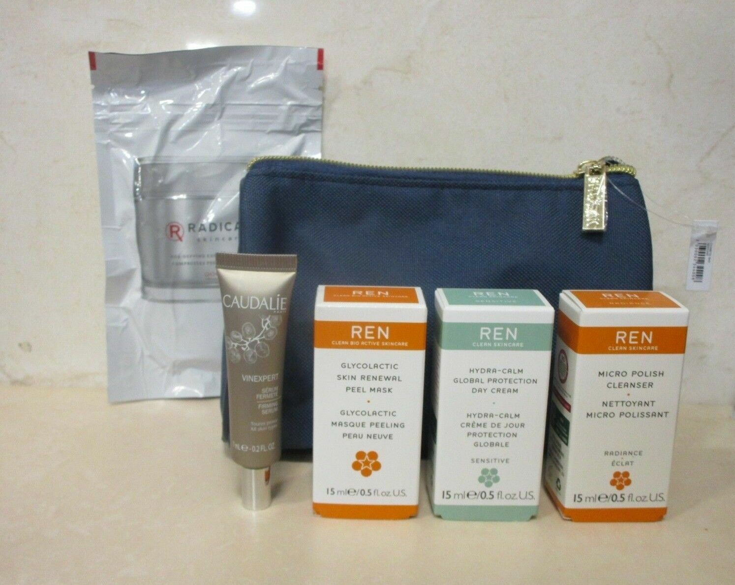 RADICAL SKINCARE AGE-DEYING EXFOLIATING PADS 15 PADS & REN PRODUCTS & MAKEUP BAG