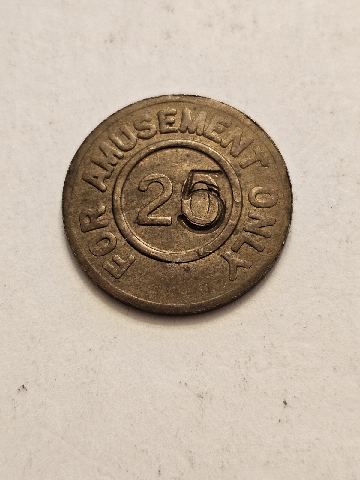 TOKEN COUNTERSTAMPED 25/20 CENTS FOR AMUSEMENT ONLY NO REFUND/RETURN FREE SHIP