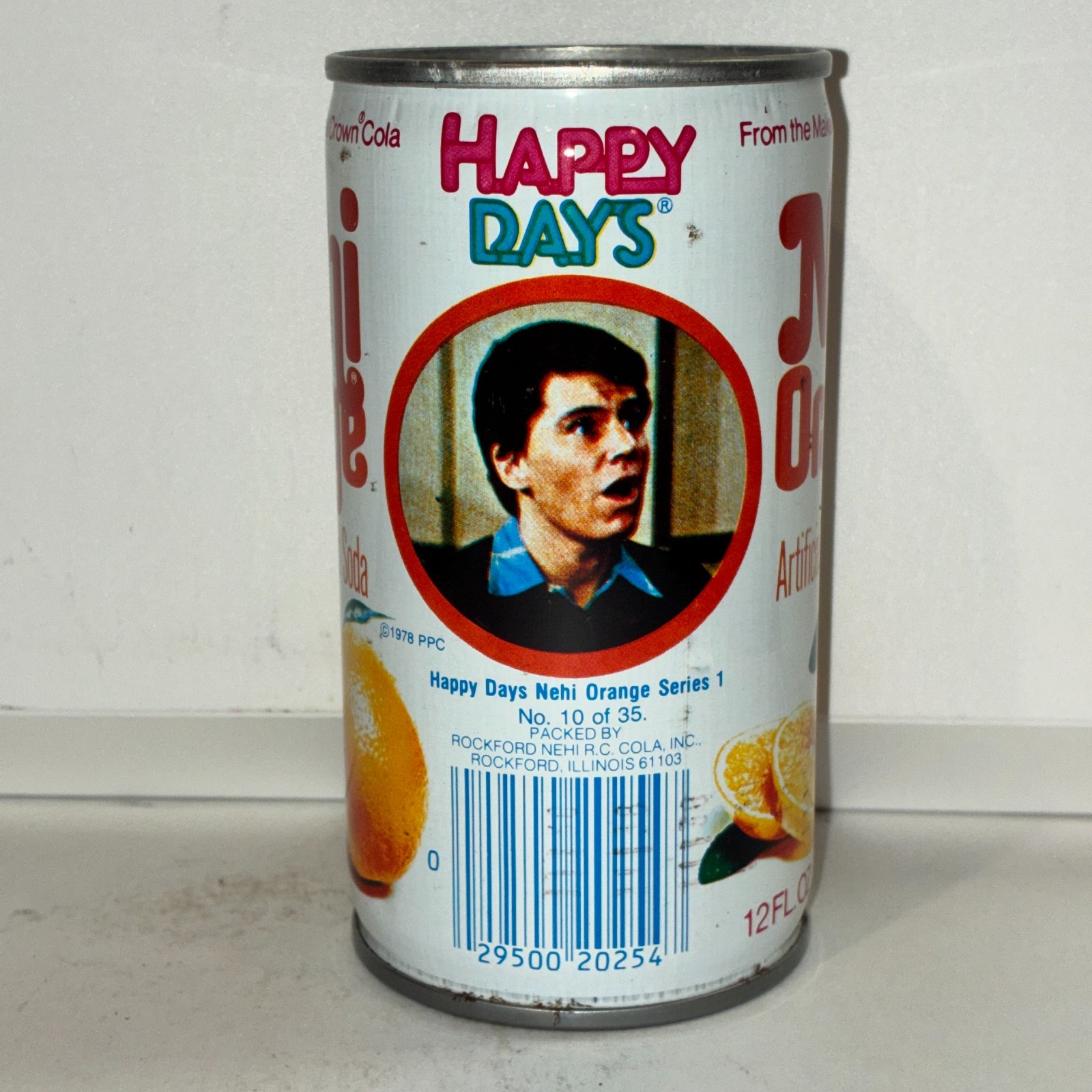 1970's Nehi Happy Days Orange Soda can, #10, bottom opened