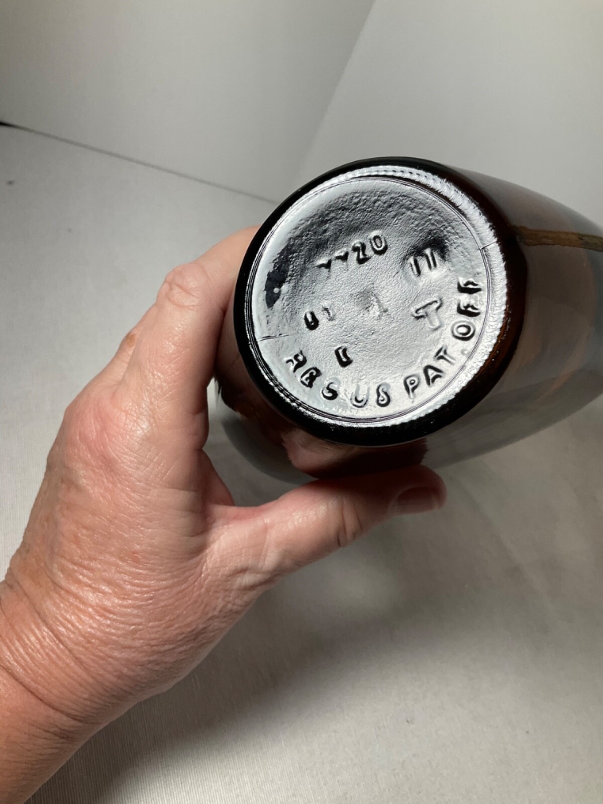 Brown glass heart shaped bottle plastic cap 9”