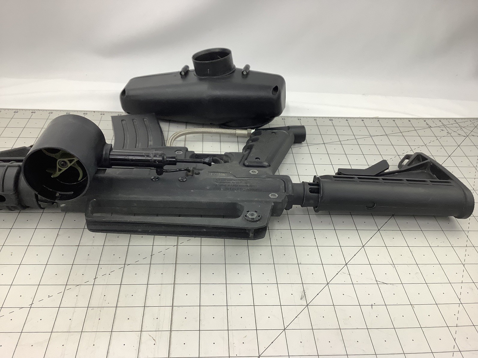 Tippmann Alpha black paintball marker with e trigger and cyclone feed untested