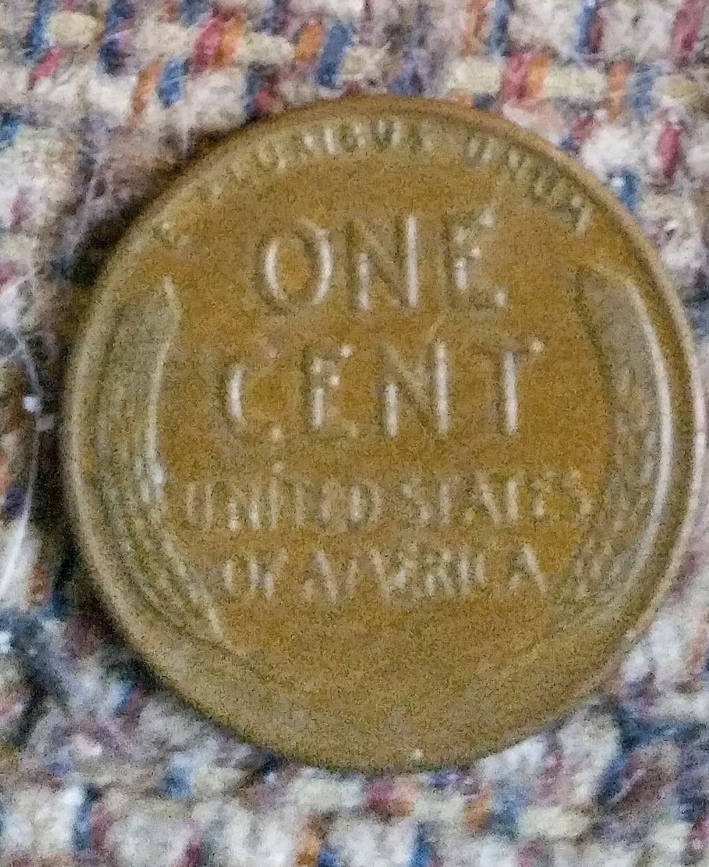 1957 D Wheat Penny. L on rim. $500. Nice coin.