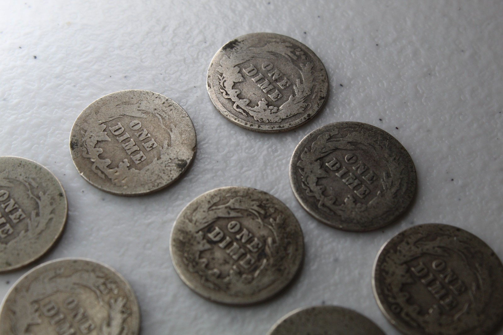 12 Very Old Very Worn Barber Dimes with dates