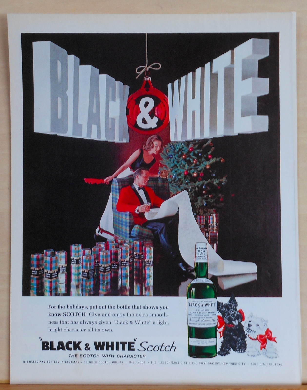 1962 magazine ad for Black & White Scotch - Christmas ad, gift boxes of B & W