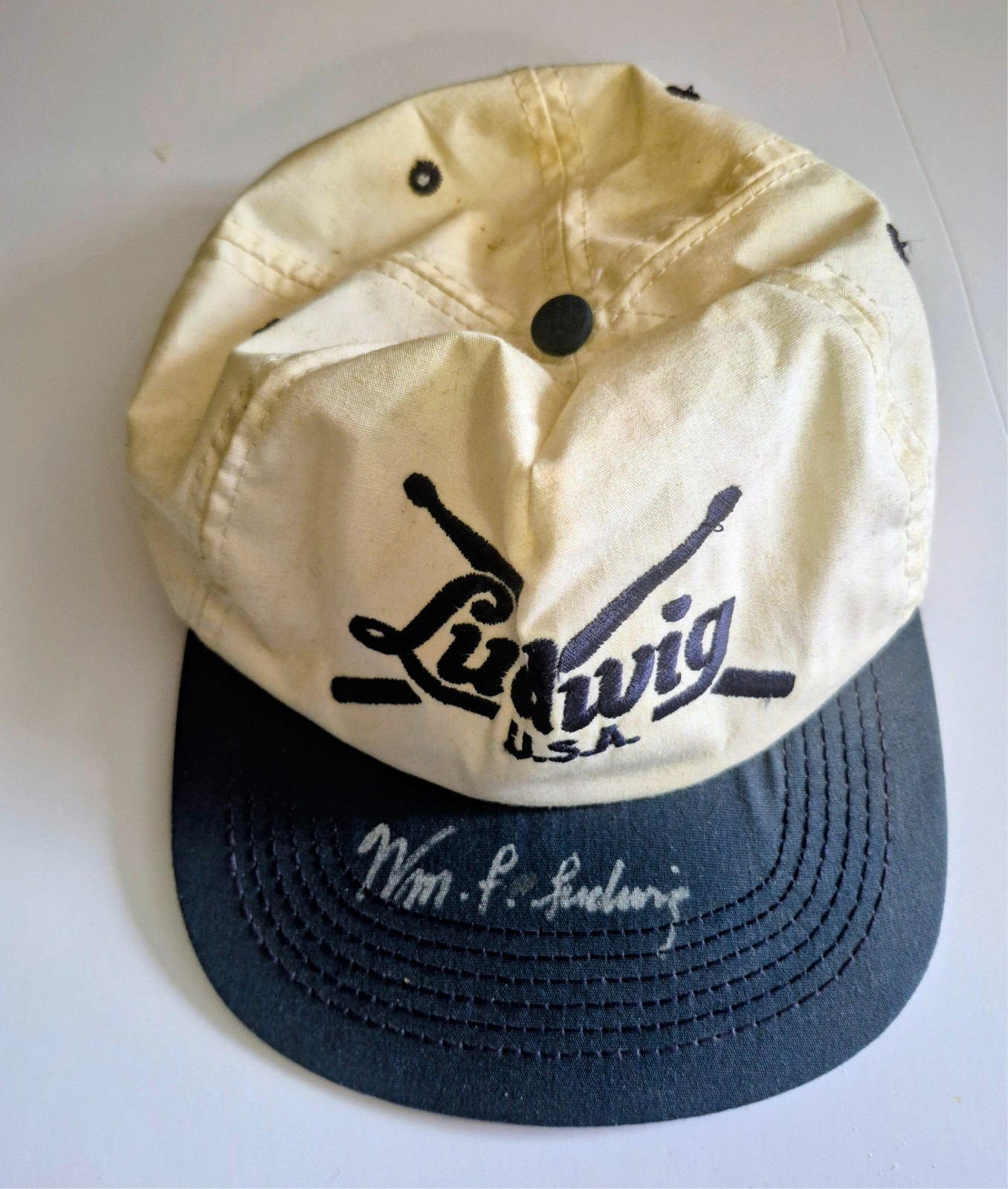 WILLIAM F LUDWIG II AUTOGRAPHED LUDWIG HAT ( SNAP BACK BROKEN) SIGNED APRIL 1996