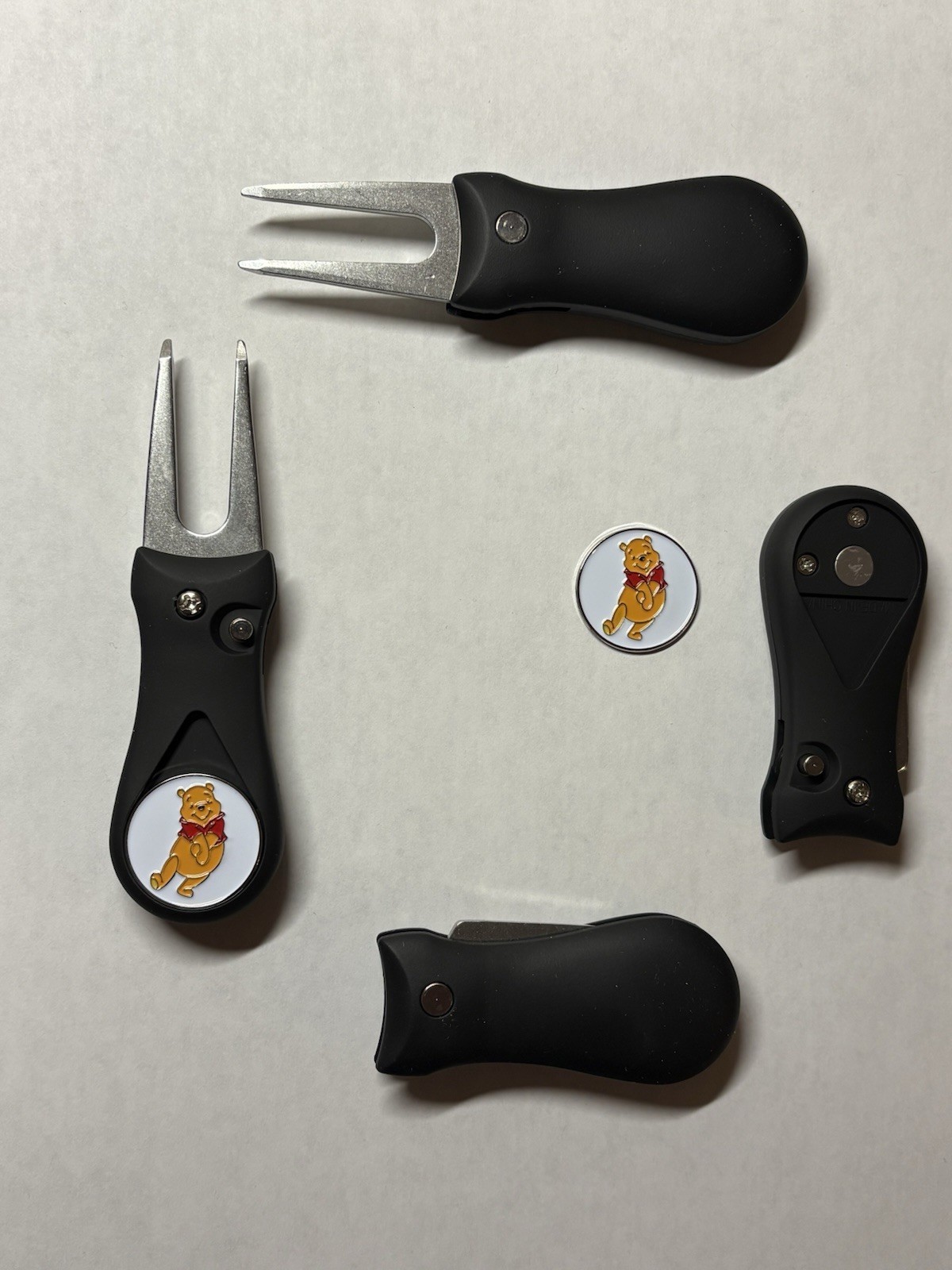 (1)  Switchblade Golf Divot Tool & (1) Winnie The Pooh 'Pooh Bear' Golf Marker