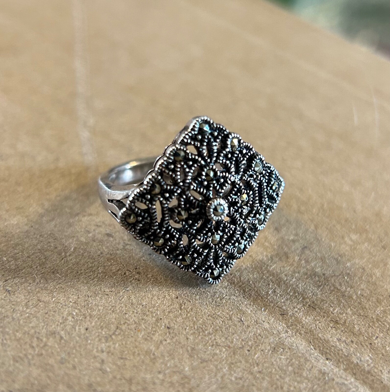 Sterling and marcasite ring. Hefty with great filigree detail