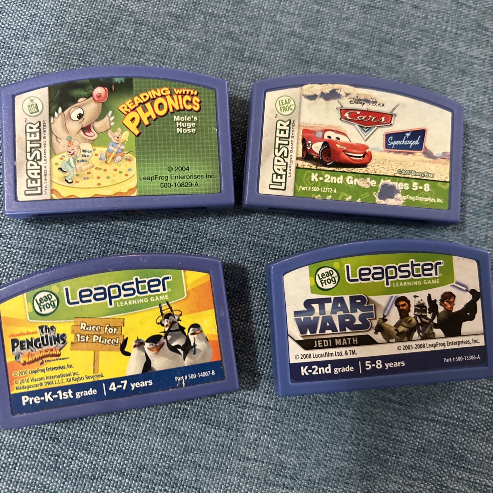 Leapster  Learning Game Lot of 4 Cartridges Star Wars Penguins Cars Phonics
