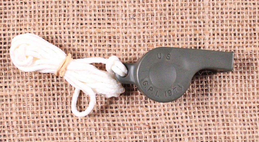 832 - OD Plastic Whistle Dated 1971 with lanyard