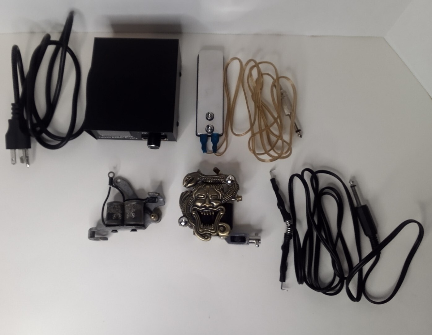 2 Tattoo Guns (1 A.K. Brand, 1 Rotary Skull) Power Supply & Cord & Foot Pedal