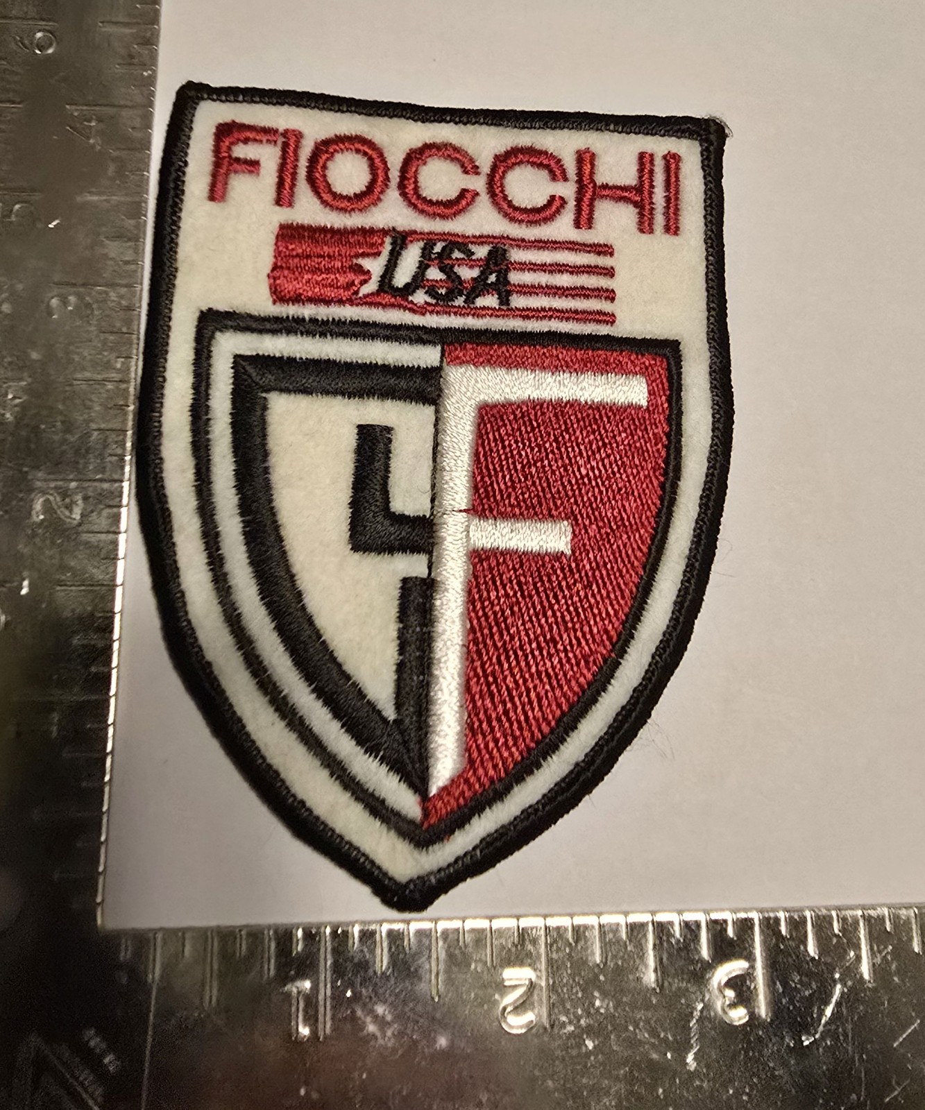 Fiocchi USA Patch – Shield Red White Black F Logo Ammunition Brand Emblem