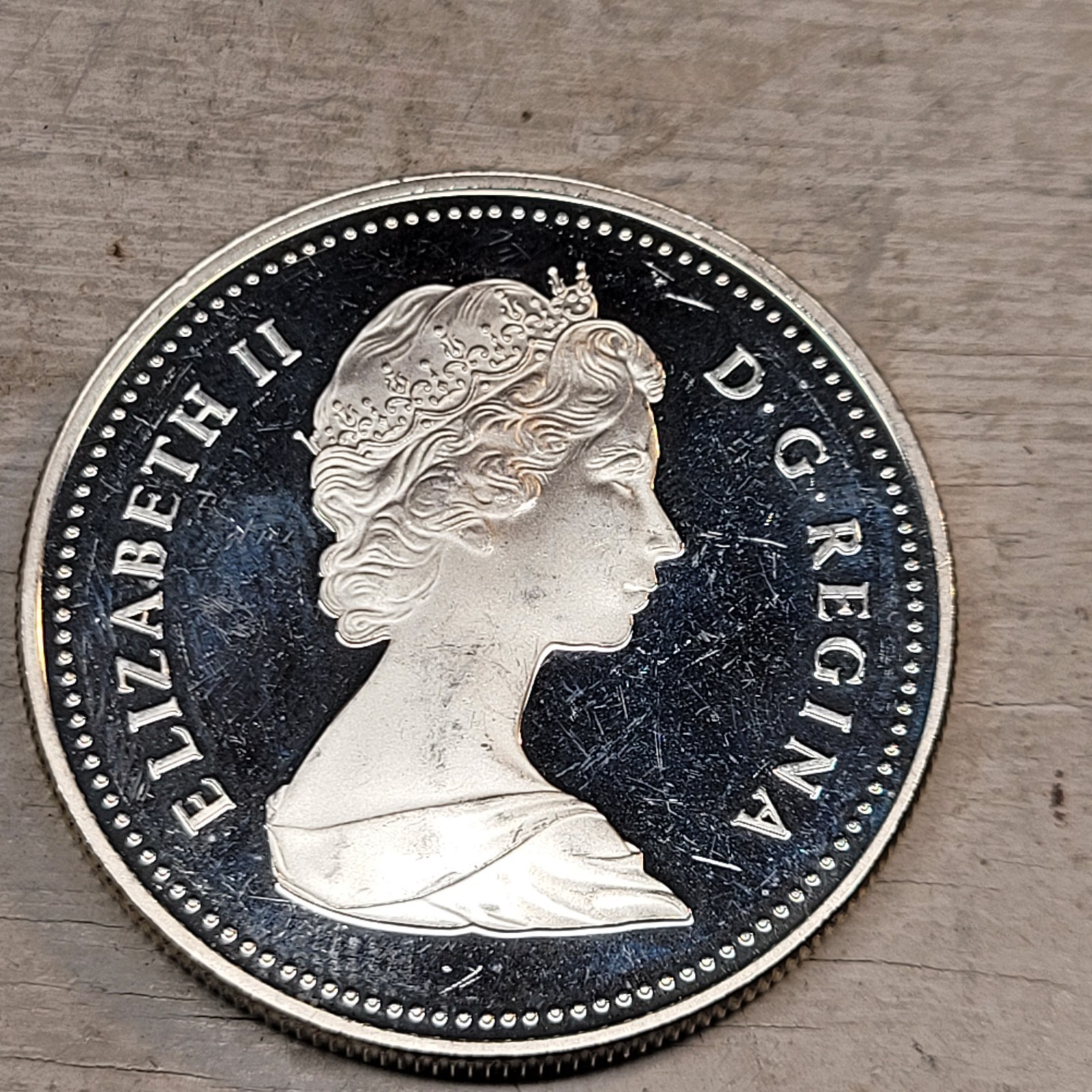 1984 Toronto Canada, .500 Silver Canoe Dollar, Proof Looking Light Scratched.