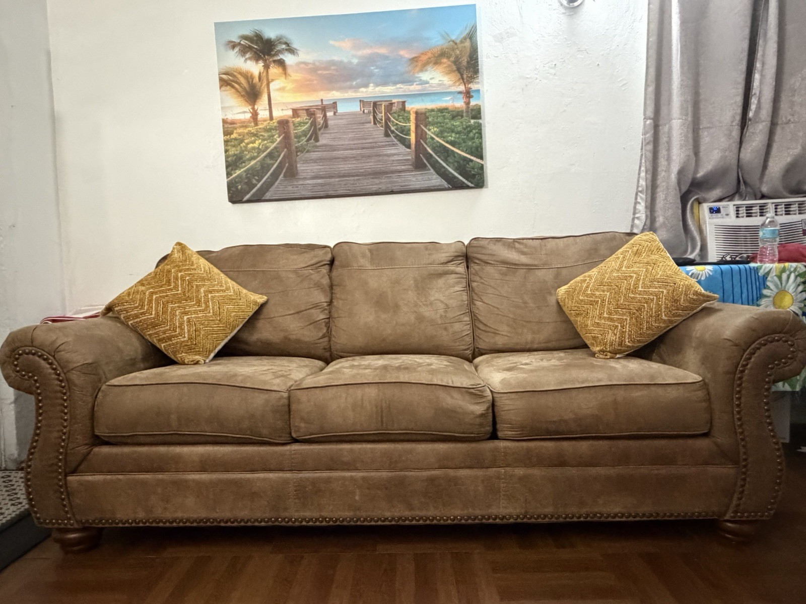 Cozy Brown Microfiber Rolled Arm 5 -Seat Sofa Nailhead Trim with cushions.