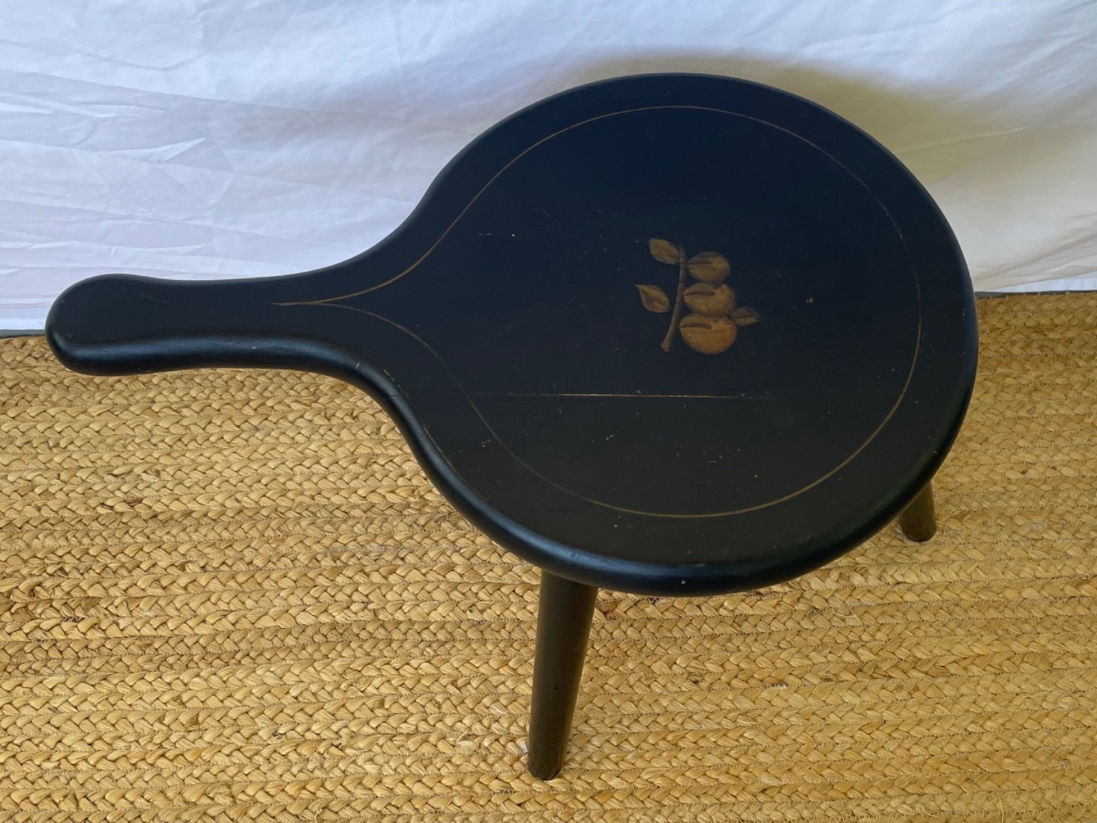 Black wooden milking stool with hand painted fruit motif vintage farmhouse style