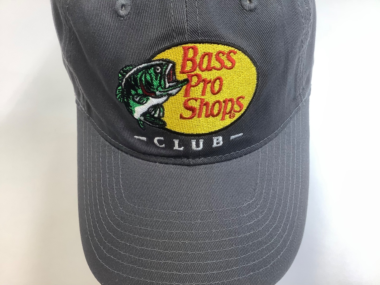 Bass Pro Shops Club Cap in dark gray with fish, adjustable to fit most people