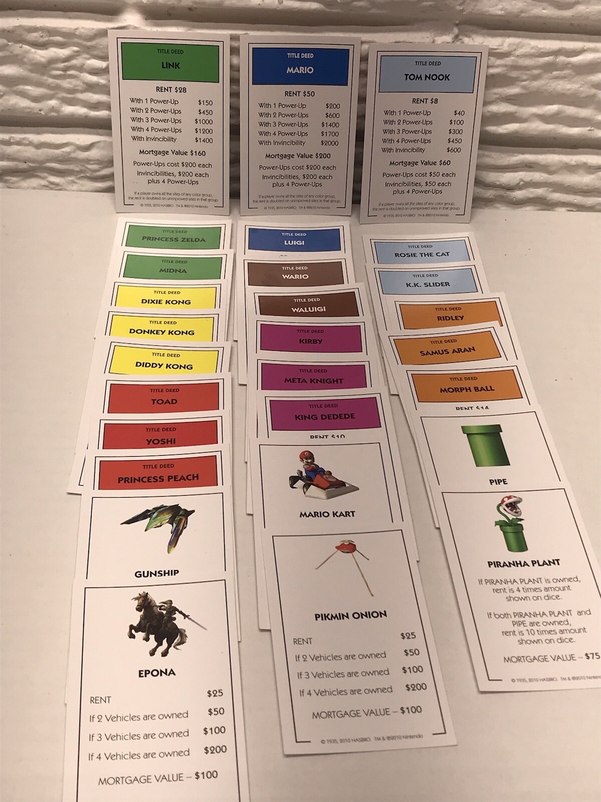2010 Monopoly NINTENDO Title Deed Cards Complete 28 Card Set