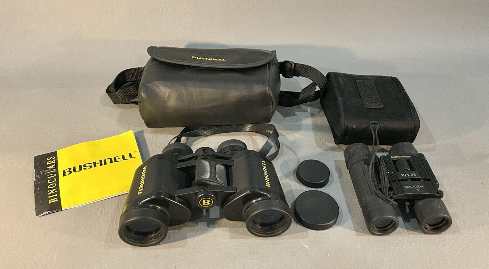 Bushnell 7X35 Binoculars/Smith & Wesson 10x25 Pocket Binoculars w/Carrying Cases
